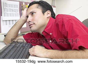 Stock Photo - businessman bored 
at work. fotosearch 
- search stock 
photos, pictures, 
images, and photo 
clipart