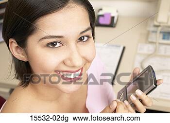 Stock Photo - businesswoman 
with a pda. fotosearch 
- search stock 
photos, pictures, 
images, and photo 
clipart