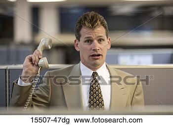 Stock Photo - businessman holding 
phone. fotosearch 
- search stock 
photos, pictures, 
images, and photo 
clipart