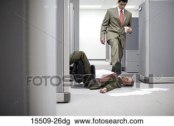 Stock Photo - businessman stepping 
over collapsed 
businessman in 
cubicle entrance. 
fotosearch - search 
stock photos, 
pictures, images, 
and photo clipart