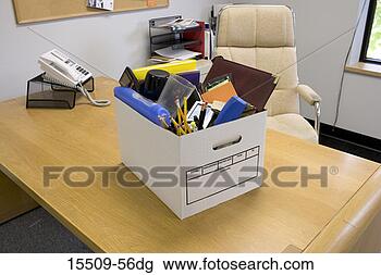 Stock Photo - employee's office 
supplies in box 
on top of desk, 
 moving in,  moving. 
fotosearch - search 
stock photos, 
pictures, images, 
and photo clipart