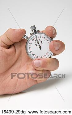 Stock Photo - hand holding stop 
watch. fotosearch 
- search stock 
photos, pictures, 
images, and photo 
clipart