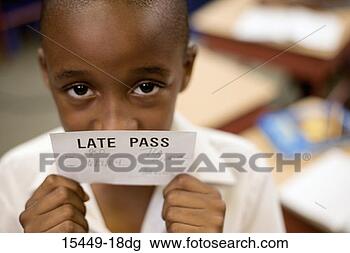 Stock Photo - boy holding late 
pass. fotosearch 
- search stock 
photos, pictures, 
images, and photo 
clipart
