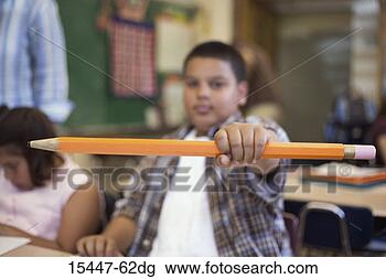 Stock Photo - boy with giant 
pencil, in classroom. 
fotosearch - search 
stock photos, 
pictures, images, 
and photo clipart
