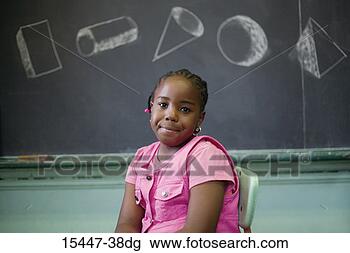 Stock Photo - girl by blackboard. 
fotosearch - search 
stock photos, 
pictures, images, 
and photo clipart