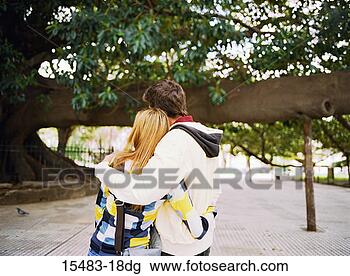 Stock Photo - backview of couple 
hugging under 
a tree in buenos 
aires. fotosearch 
- search stock 
photos, pictures, 
images, and photo 
clipart