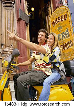 Stock Photo - man and woman 
on scooter in 
buenos aires. 
fotosearch - search 
stock photos, 
pictures, images, 
and photo clipart