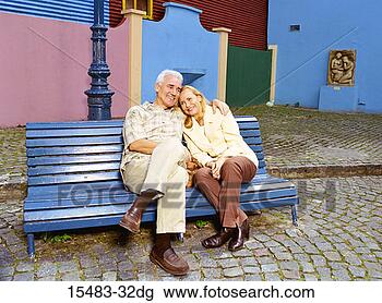 Stock Photo - older man and 
woman sitting 
on park bench 
in buenos aires. 
fotosearch - search 
stock photos, 
pictures, images, 
and photo clipart