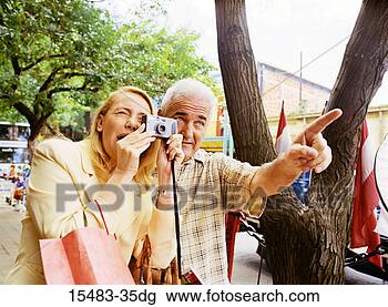 Stock Photo - older man and 
woman taking a 
photo in buenos 
aires. fotosearch 
- search stock 
photos, pictures, 
images, and photo 
clipart