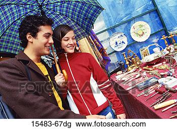 Stock Photo - young couple smiling 
in front of store 
in buenos aires. 
fotosearch - search 
stock photos, 
pictures, images, 
and photo clipart