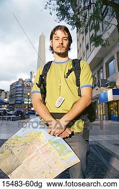 Stock Photo - young man holding 
map in square 
in buenos aires. 
fotosearch - search 
stock photos, 
pictures, images, 
and photo clipart