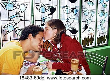 Stock Photo - young woman kissing 
young man's forehead 
at caf¿n buenos 
aires. fotosearch 
- search stock 
photos, pictures, 
images, and photo 
clipart