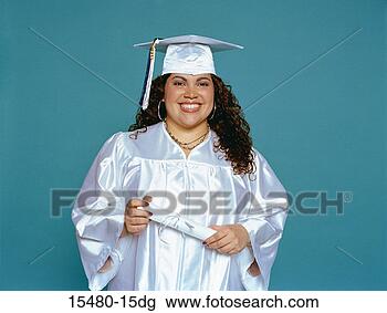 Stock Photo - plus-sized woman 
wearing graduation 
outfit, holding 
diploma, smiling. 
fotosearch - search 
stock photos, 
pictures, images, 
and photo clipart