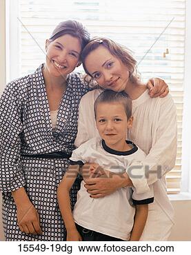 Stock Photo - couple and child 
hugging. fotosearch 
- search stock 
photos, pictures, 
images, and photo 
clipart