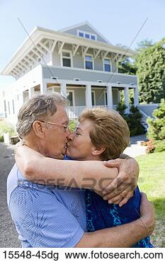 Stock Photo - couple kissing 
in front of house. 
fotosearch - search 
stock photos, 
pictures, images, 
and photo clipart