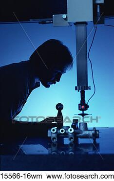 Stock Photo - silhouette of 
worker at auto 
parts manufacturing 
plant. fotosearch 
- search stock 
photos, pictures, 
images, and photo 
clipart