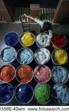 Stock Photo - warehouse worker 
with barrels of 
colorful telecommunications 
wires. fotosearch 
- search stock 
photos, pictures, 
images, and photo 
clipart