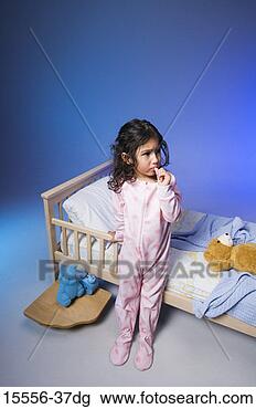 Stock Photo - girl in pajamas 
standing by toddler 
bed. fotosearch 
- search stock 
photos, pictures, 
images, and photo 
clipart