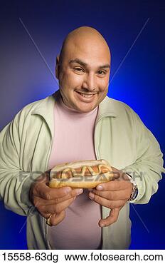 Stock Photo - man with a hot 
dog. fotosearch 
- search stock 
photos, pictures, 
images, and photo 
clipart