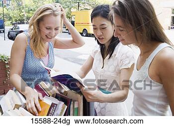 Stock Photo - women shopping 
for books. fotosearch 
- search stock 
photos, pictures, 
images, and photo 
clipart