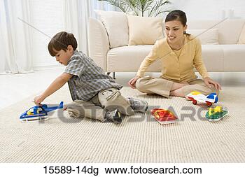Stock Photo - mother and son 
playing with toys. 
fotosearch - search 
stock photos, 
pictures, images, 
and photo clipart