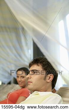 Stock Photo - couple sitting 
on lounge chairs 
at spa. fotosearch 
- search stock 
photos, pictures, 
images, and photo 
clipart