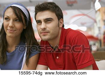 Stock Photo - couple sitting 
outdoors. fotosearch 
- search stock 
photos, pictures, 
images, and photo 
clipart