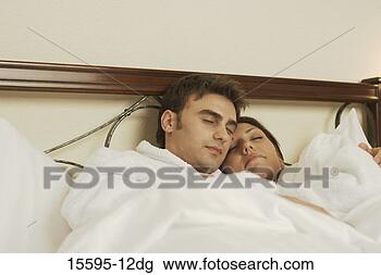 Stock Photo - couple sleeping 
in bed. fotosearch 
- search stock 
photos, pictures, 
images, and photo 
clipart