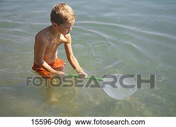 Banco de Imagem - menino,  pesca, 
 rede. fotosearch 
- busca de fotos, 
imagens e clipart