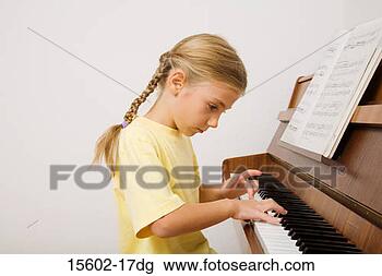 Stock Photo - girl playing piano. 
fotosearch - search 
stock photos, 
pictures, images, 
and photo clipart