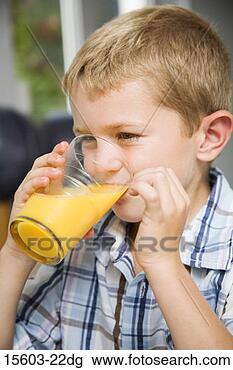 Stock Photo - boy drinking orange 
juice. fotosearch 
- search stock 
photos, pictures, 
images, and photo 
clipart