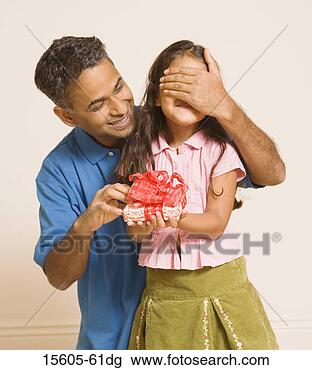 Stock Photo - father giving 
daughter present. 
fotosearch - search 
stock photos, 
pictures, images, 
and photo clipart