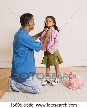 Stock Photo - father helping 
daughter put on 
jacket. fotosearch 
- search stock 
photos, pictures, 
images, and photo 
clipart