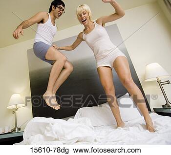 http://comps.fotosearch.com/comp/CRT/CRT543/couple-jumping-bed_~15610-78dg.jpg