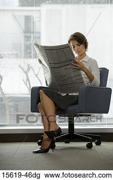Stock Photo - businesswoman 
reading newspaper. 
fotosearch - search 
stock photos, 
pictures, images, 
and photo clipart