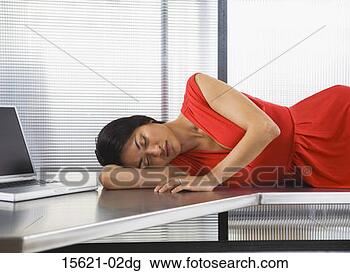 businesswoman-sleeping-desk_~15621-02dg.jpg