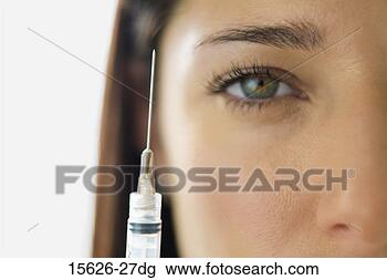 Stock Photo - woman with hypodermic 
needle. fotosearch 
- search stock 
photos, pictures, 
images, and photo 
clipart