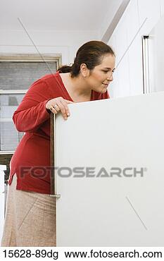 Stock Photo - woman looking 
in refrigerator. 
fotosearch - search 
stock photos, 
pictures, images, 
and photo clipart