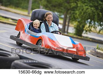 Stock Photo - mother and son 
riding in go-cart. 
fotosearch - search 
stock photos, 
pictures, images, 
and photo clipart