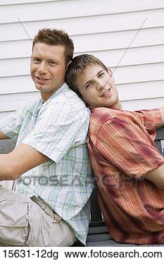 Stock Photo - gay couple back 
to back. fotosearch 
- search stock 
photos, pictures, 
images, and photo 
clipart