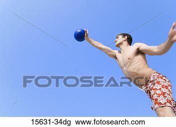 Stock Photo - man jumping and 
hitting volley 
ball. fotosearch 
- search stock 
photos, pictures, 
images, and photo 
clipart