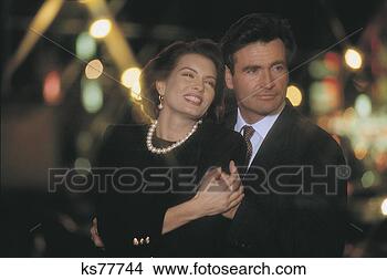 Stock Photo - couple hugging 
outdoors. fotosearch 
- search stock 
photos, pictures, 
images, and photo 
clipart