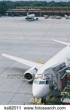 Stock Photography - airplane at gate. 
fotosearch - search 
stock photos, 
pictures, images, 
and photo clipart