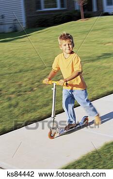 Stock Photo - boy on scooter. 
fotosearch - search 
stock photos, 
pictures, images, 
and photo clipart