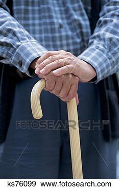 Stock Photograph - male hands on 
a cane. fotosearch 
- search stock 
photos, pictures, 
images, and photo 
clipart