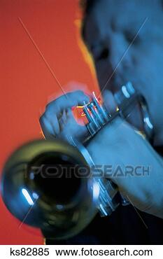Stock Image - man playing trumpet, 
blurred. fotosearch 
- search stock 
photos, pictures, 
images, and photo 
clipart
