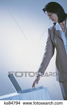 Stock Photo - woman with laptop 
computer. fotosearch 
- search stock 
photos, pictures, 
images, and photo 
clipart