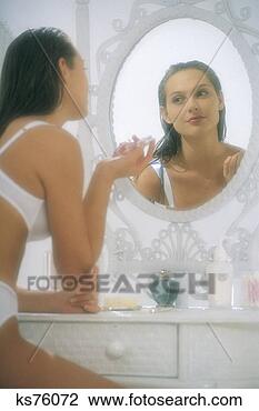 Stock Photo - woman looking 
in the mirror. 
fotosearch - search 
stock photos, 
pictures, images, 
and photo clipart