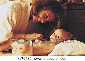 Stock Photography - woman playing 
with baby. fotosearch 
- search stock 
photos, pictures, 
images, and photo 
clipart