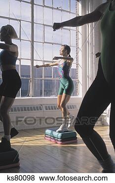 Stock Photo - women doing step 
aerobics. fotosearch 
- search stock 
photos, pictures, 
images, and photo 
clipart
